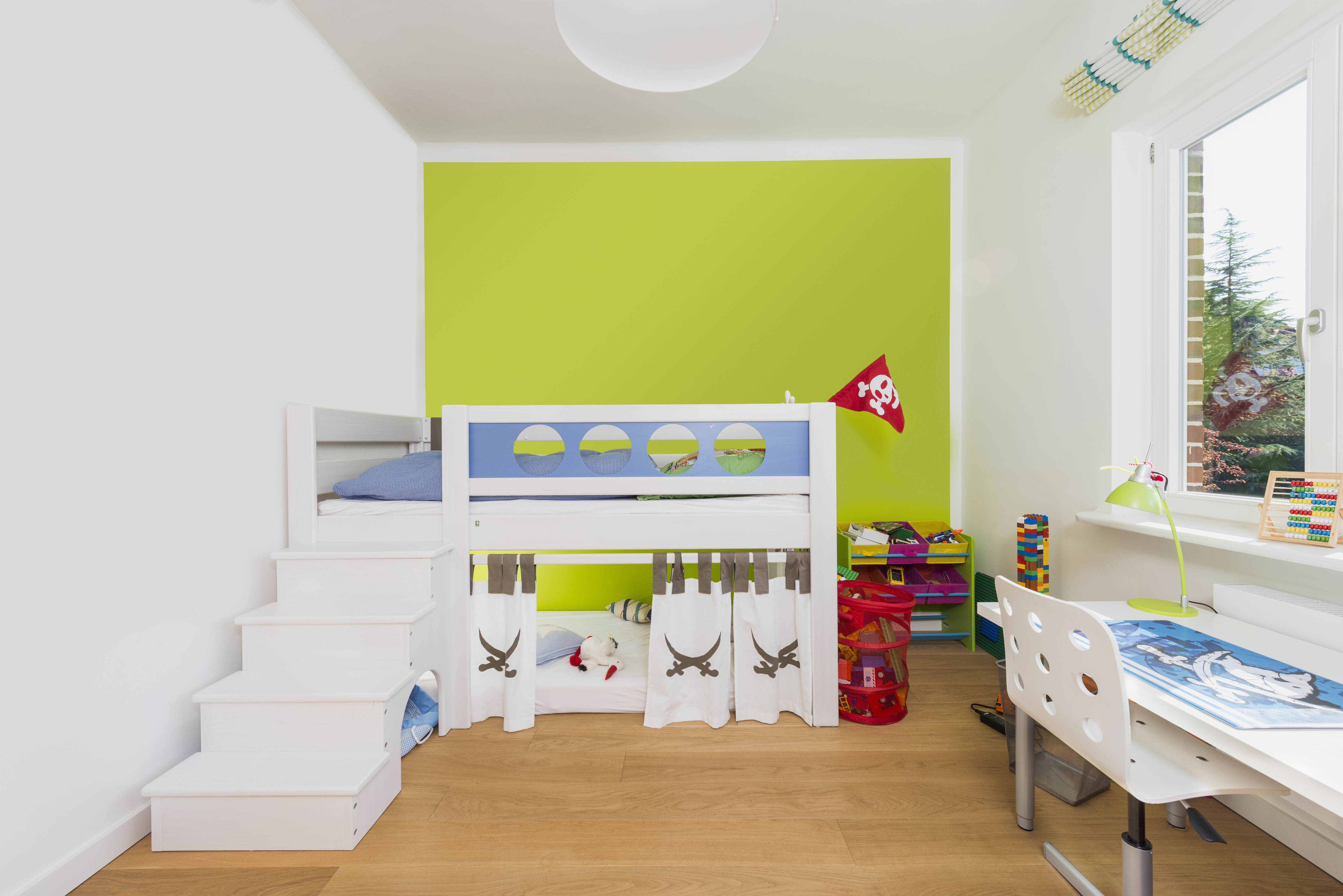 Modern children's room with wooden floor
